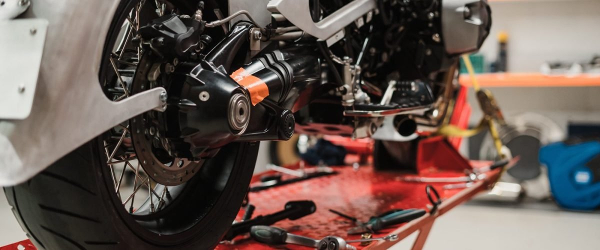 custom-motorcycle-standing-repair-shop-scaled.jpg custom-motorcycle-standing-repair-shop-scaled.jpg